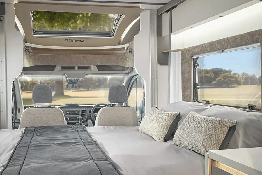 Modern Interior of a Bailey Motorhome Cozy interior view of a Bailey motorhome featuring seating and a sleeping area, designed for comfort and adventure.