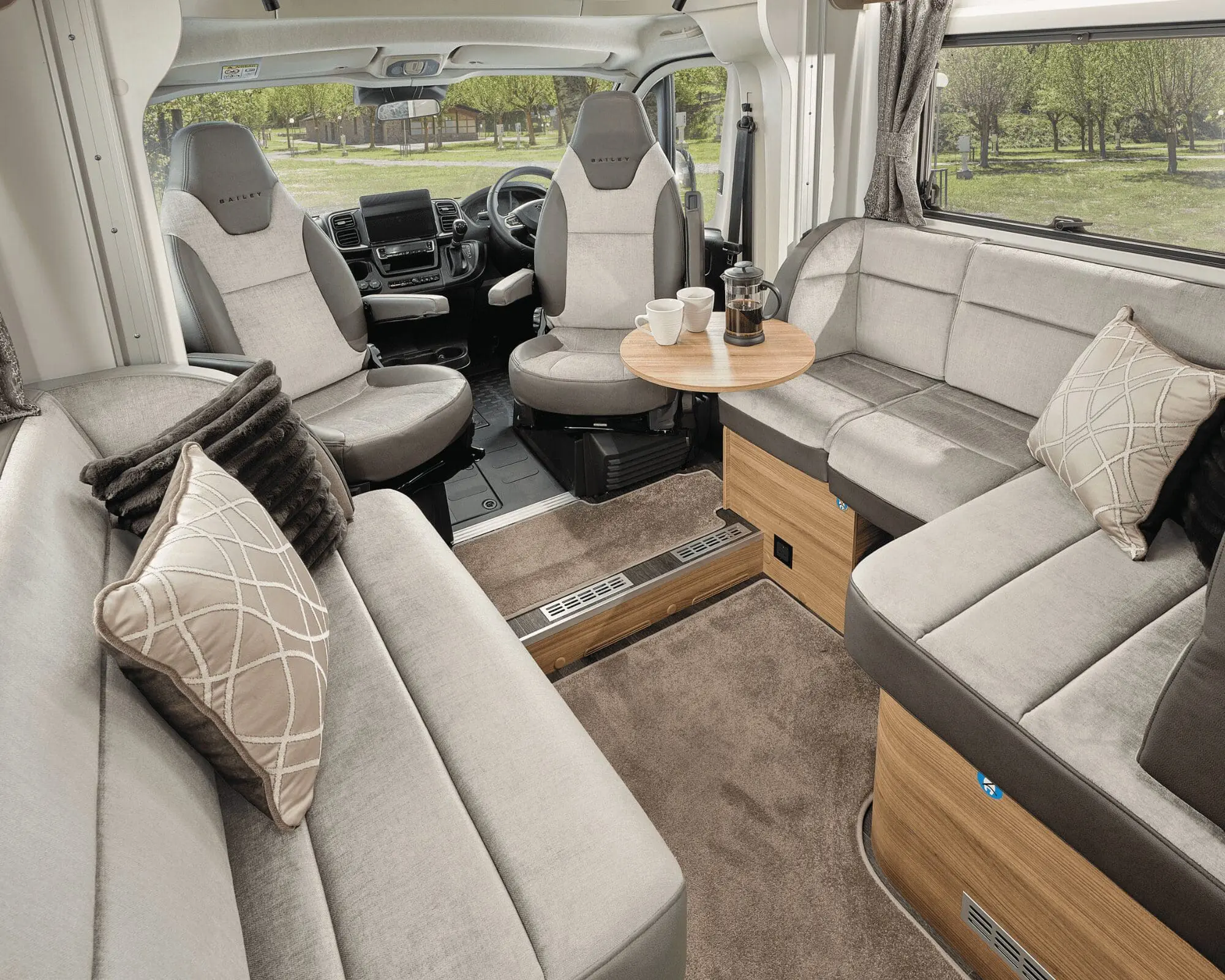 Comfortable seating area in a Bailey motorhome with stylish decor and ample space