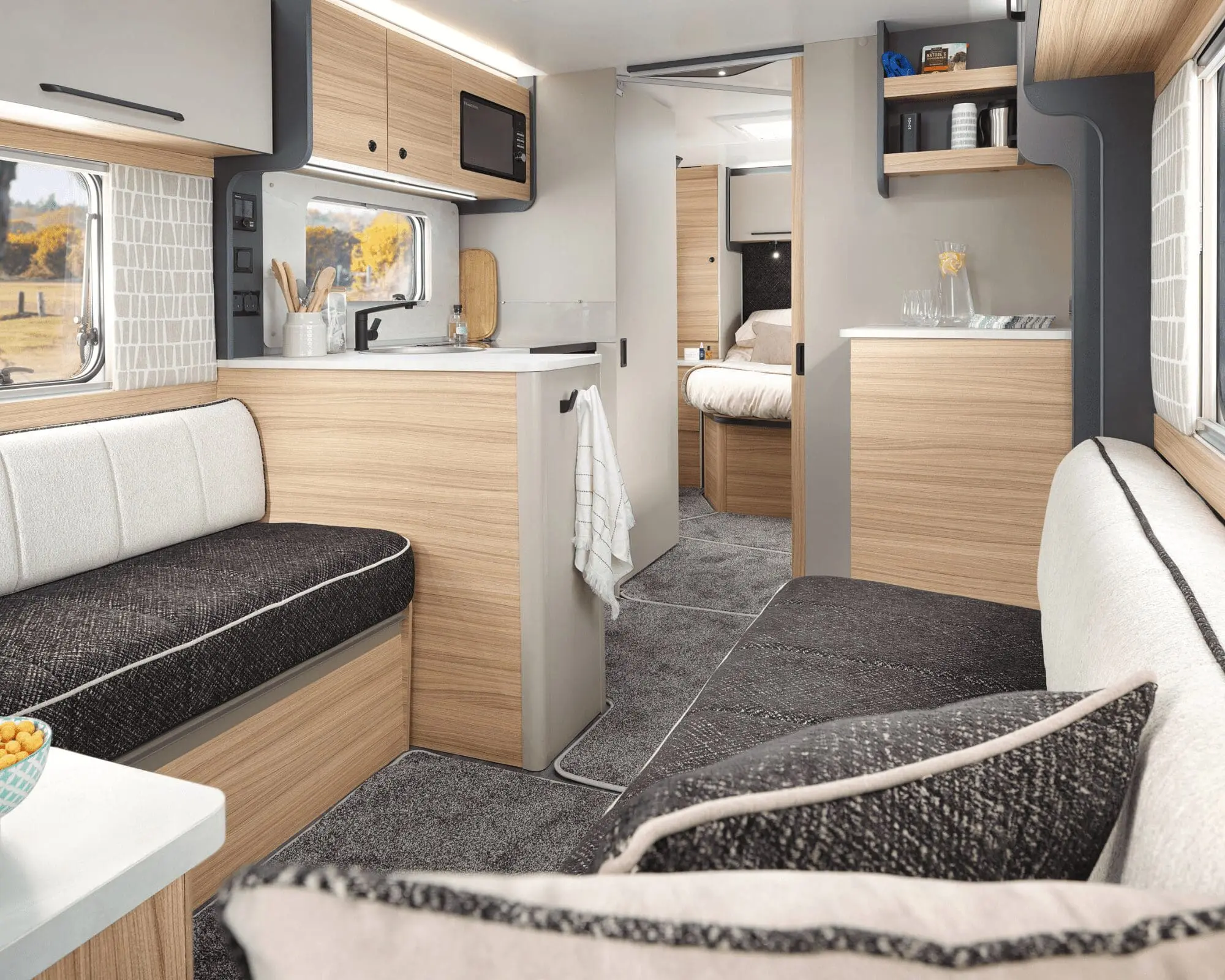 Interior View of a Modern Bailey Caravan Spacious and stylish interior design of a Bailey caravan with comfortable seating and well-equipped kitchen area.