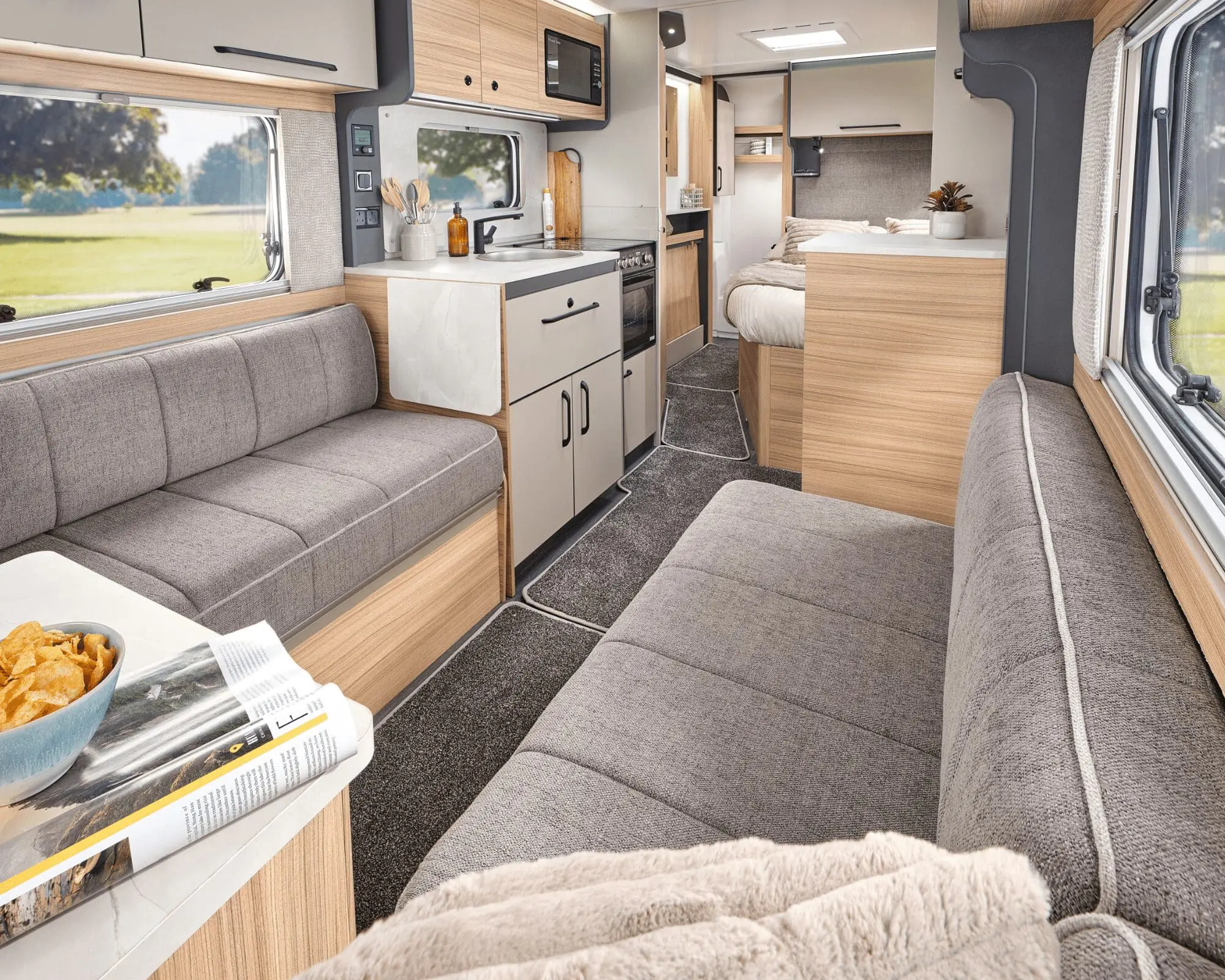 Modern Bailey Caravan Interior Spacious and stylish interior of a Bailey caravan, featuring comfortable seating and kitchen amenities.