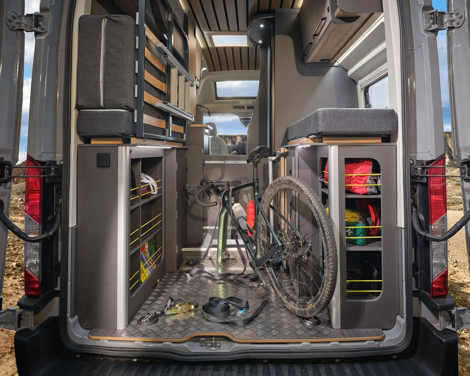 Spacious Campervan interior featuring organized storage and a bicycle ready for adventure.