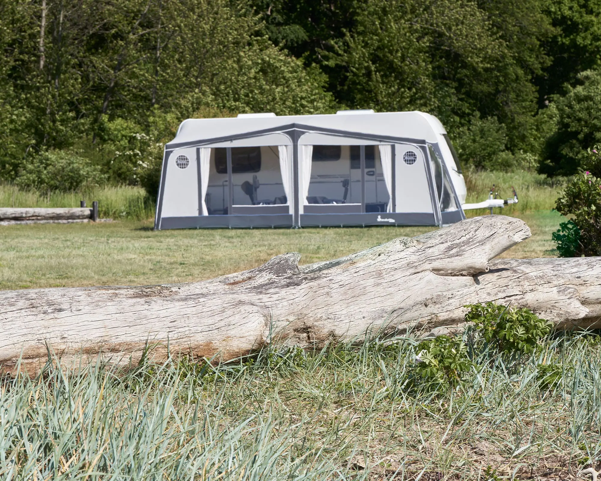 A beautiful Isabella awning set up in a tranquil outdoor setting, perfect for enhancing your caravan or motorhome experience.