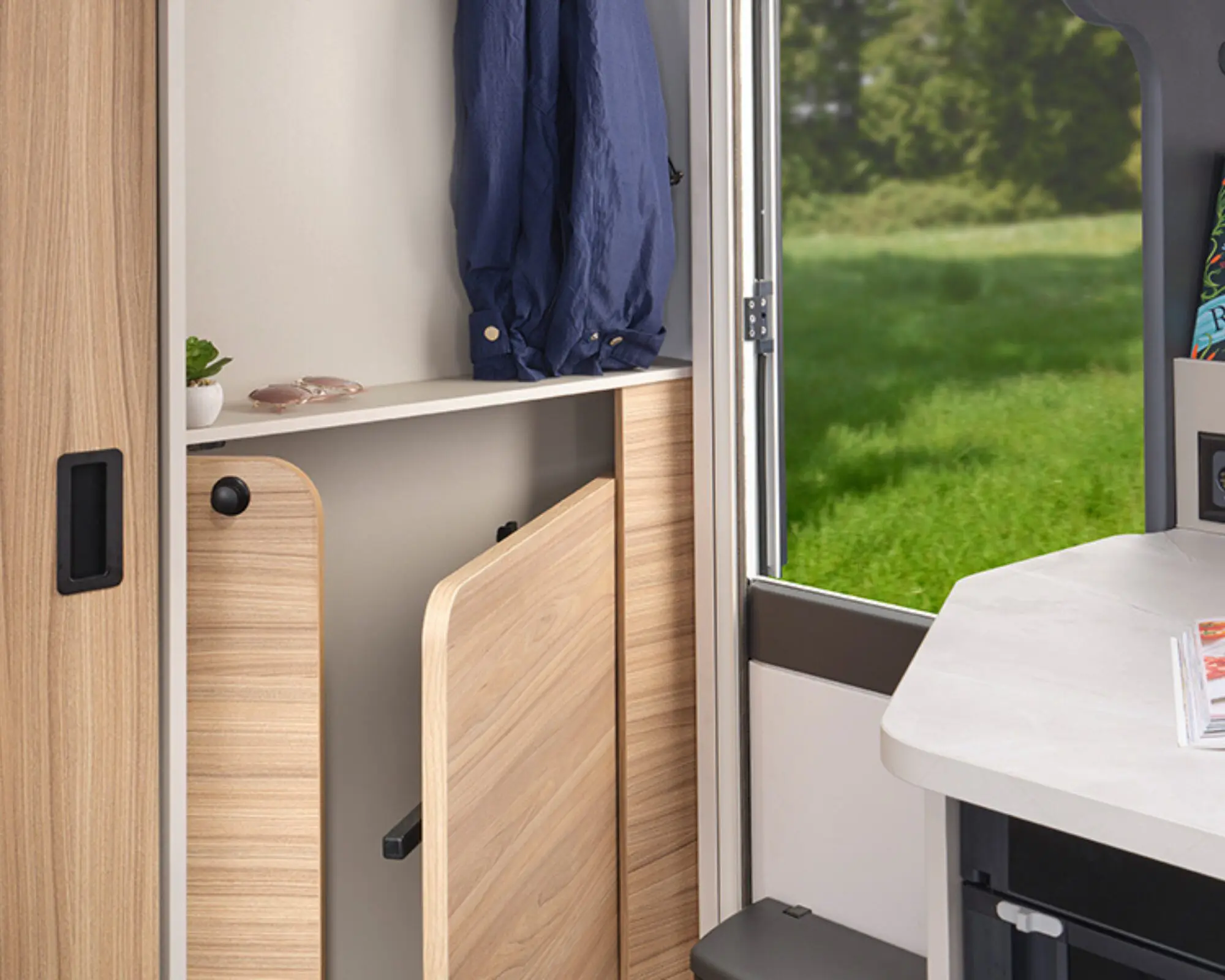 Front entrance keeps you well-equipped for all weathers with coat hooks, side unit and freestanding dining table with storage