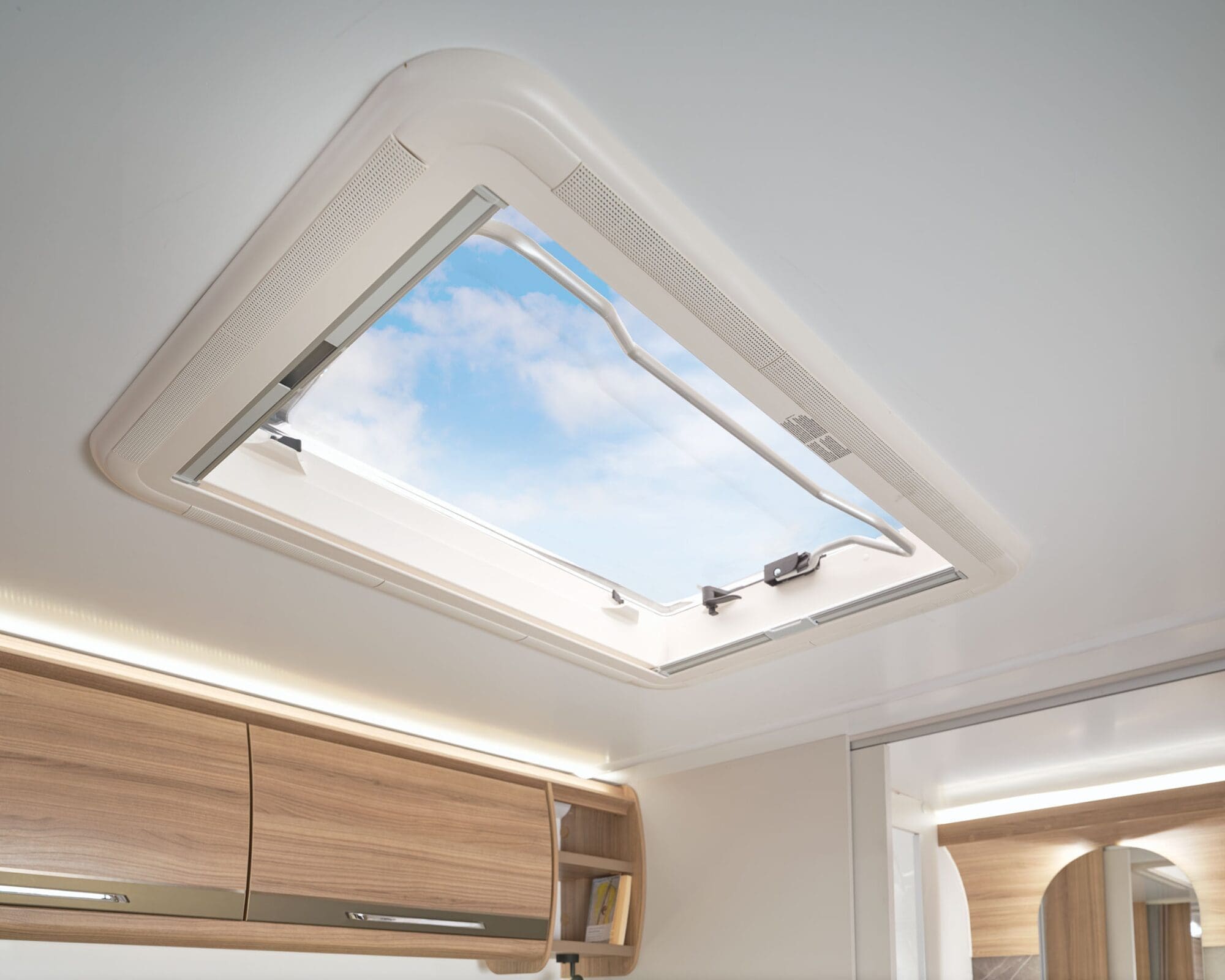 Open roof vent showing blue sky inside a Bailey motorhome