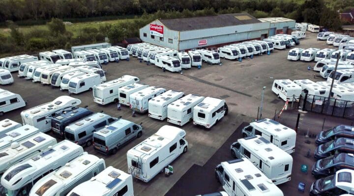 Overview of a large inventory of Bailey caravans and motorhomes in a dealership lot