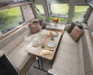 Dining table set in the front lounge of the Bailey Unicorn Lite Seville 2027