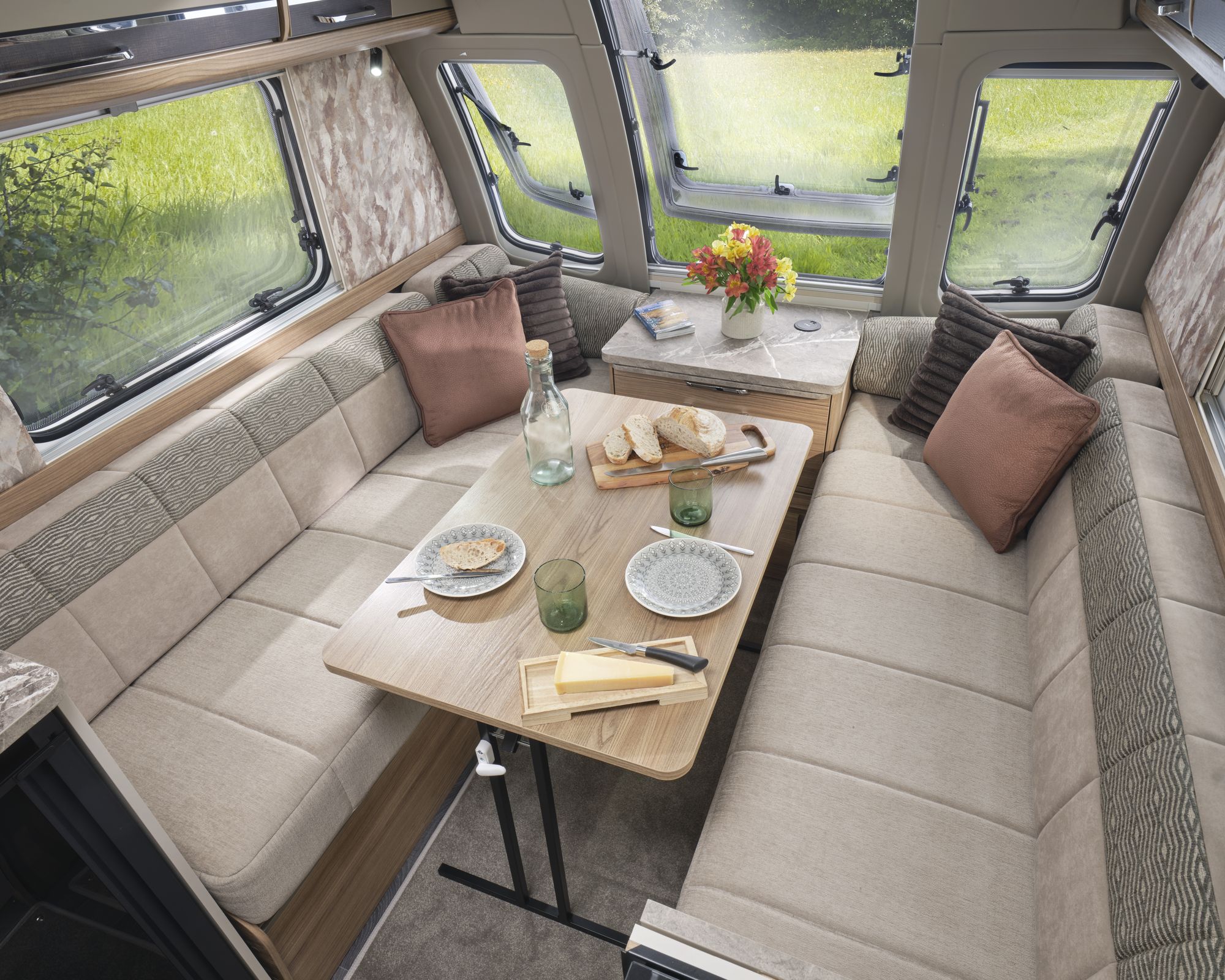 Dining table set in the front lounge of the Bailey Unicorn Lite Seville 2027